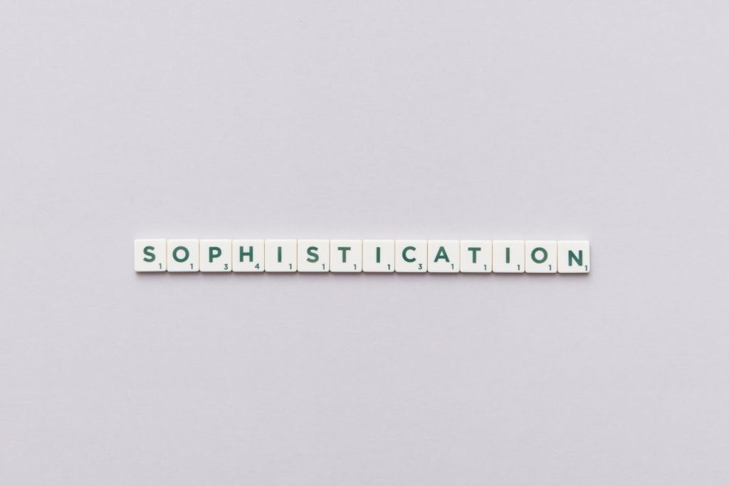 Letter tiles spelling out 'Sophistication' on a neutral background, perfect for conceptual themes.