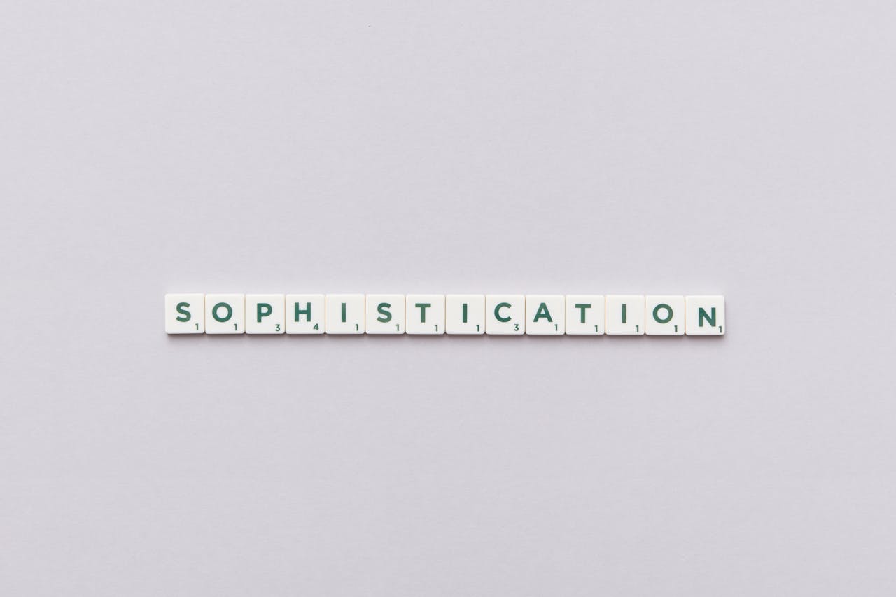Letter tiles spelling out 'Sophistication' on a neutral background, perfect for conceptual themes.